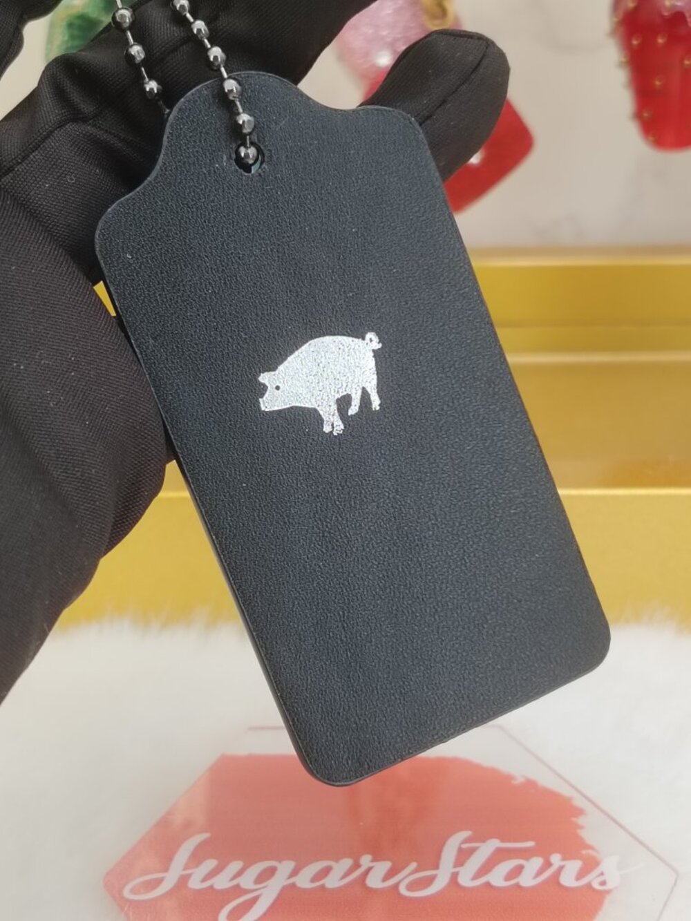 Coach black tag